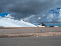 a person is on the top of a ramp on a steep hill by the ocean