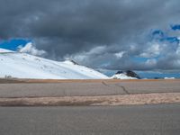 a person is on the top of a ramp on a steep hill by the ocean