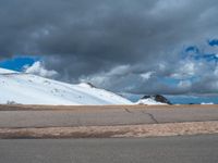 a person is on the top of a ramp on a steep hill by the ocean