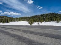 Colorado Landscape: Snowy Road, Mountains, and a Lake