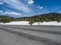 Colorado Landscape: Snowy Road, Mountains, and a Lake