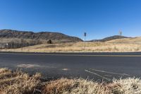 this is a shot of the road on the hillside with no cars in it and one lane that looks similar to the highway