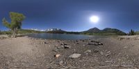 the water is running out into a lake, as it appears to be full of rocks and boulders