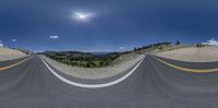 a curved roadway that looks like it has been turned upside down to see the sun in the sky