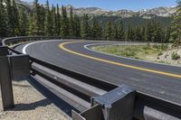 curved curving road with a road divider in the middle and two bend of it