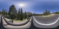 a curved mountain road is shown in a 360 - view camera style with a sky background