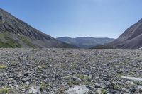 the road is graveled and it has a very small slope at the bottom of the mountains