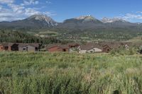 an idylic view of the town and mountains from atop a hill in colorado