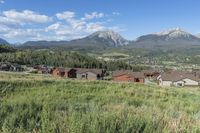 an idylic view of the town and mountains from atop a hill in colorado