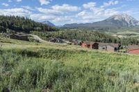 an idylic view of the town and mountains from atop a hill in colorado