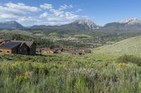 an idylic view of the town and mountains from atop a hill in colorado