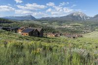 an idylic view of the town and mountains from atop a hill in colorado