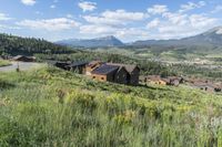 an idylic view of the town and mountains from atop a hill in colorado