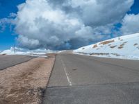 a person is on the top of a ramp on a steep hill by the ocean