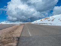 a person is on the top of a ramp on a steep hill by the ocean