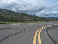 Colorado Road: A Scenic Landscape Leading to a Beautiful Lake