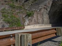 a road goes into a tunnel and through the hill to the other side of it