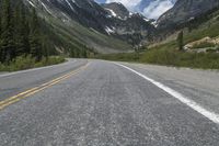 the empty road with mountains and trees in the background that looks great for an image