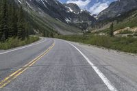 the empty road with mountains and trees in the background that looks great for an image