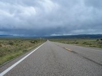 Colorado Road: Winding Through Nature under a Gloomy Grey Sky