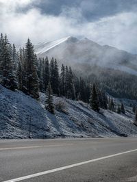 Snow Covered Road in Colorado's Mountain Landscape