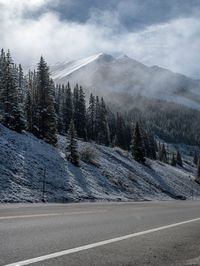 Snow Covered Road in Colorado's Mountain Landscape