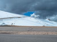 a person is on the top of a ramp on a steep hill by the ocean