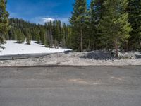 Snowy Road in Colorado: A Landscape Leading to a Tranquil Lake