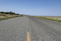 a very long empty highway with no cars on it's side of the road