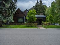 a road and trees line a residential street in a residential area in a neighborhood with no parking