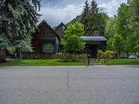 a road and trees line a residential street in a residential area in a neighborhood with no parking