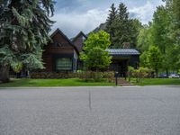 a road and trees line a residential street in a residential area in a neighborhood with no parking