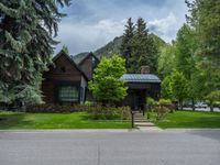 a road and trees line a residential street in a residential area in a neighborhood with no parking