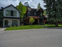 a road and trees line a residential street in a residential area in a neighborhood with no parking