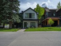 a road and trees line a residential street in a residential area in a neighborhood with no parking