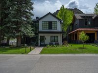 a road and trees line a residential street in a residential area in a neighborhood with no parking