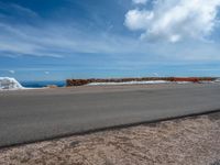 a person is on the top of a ramp on a steep hill by the ocean