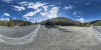 fisheye image looking at the mountains from a paved road area in colorado, usa