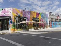 the store has many colorful exterior, including this colorful building along an empty street corner