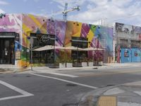 the store has many colorful exterior, including this colorful building along an empty street corner