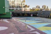 a large area covered in colorful, dotted paint on the sidewalk in front of some buildings