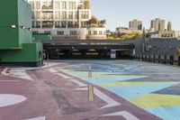 a large area covered in colorful, dotted paint on the sidewalk in front of some buildings