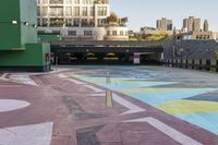 a large area covered in colorful, dotted paint on the sidewalk in front of some buildings