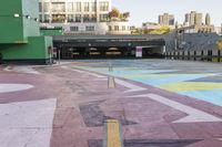 a large area covered in colorful, dotted paint on the sidewalk in front of some buildings