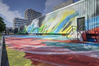 the colorful mural on a public building features bright colors and shadows, including rainbows