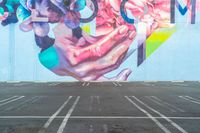 a photo of a large colorful mural painted on the side of a building with no people