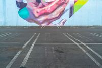 a photo of a large colorful mural painted on the side of a building with no people