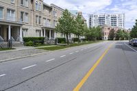 the road is lined with buildings in many different colors and designs in each area of the neighborhood