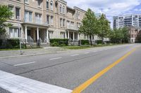 the road is lined with buildings in many different colors and designs in each area of the neighborhood