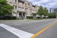 the road is lined with buildings in many different colors and designs in each area of the neighborhood